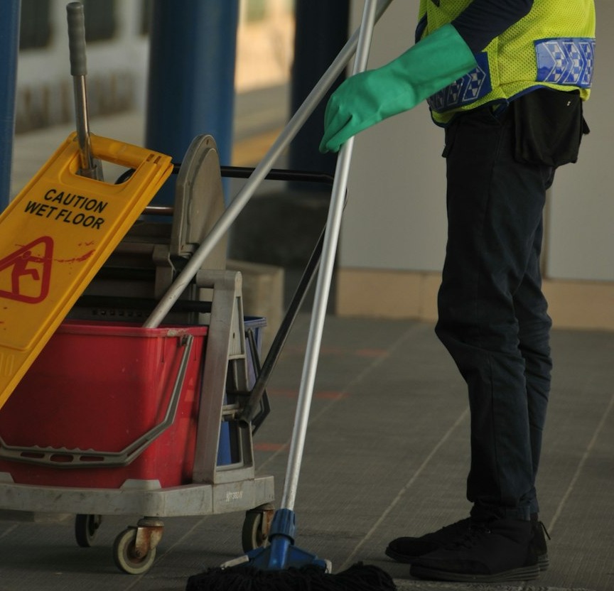 Station Clerk clearing floor